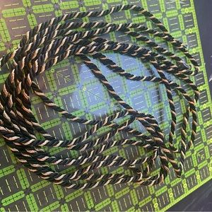 Black and gold drapery cord